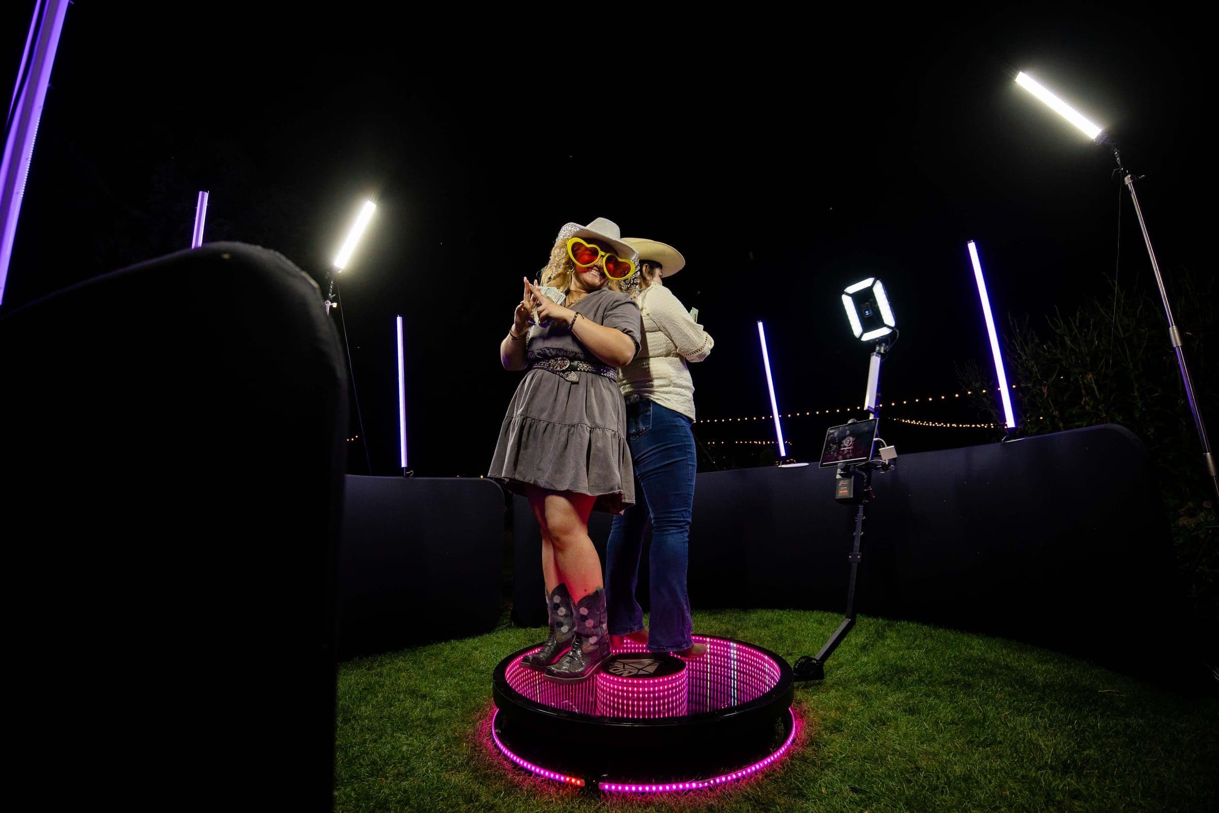 Guests smiling while recording a 360 video booth moment