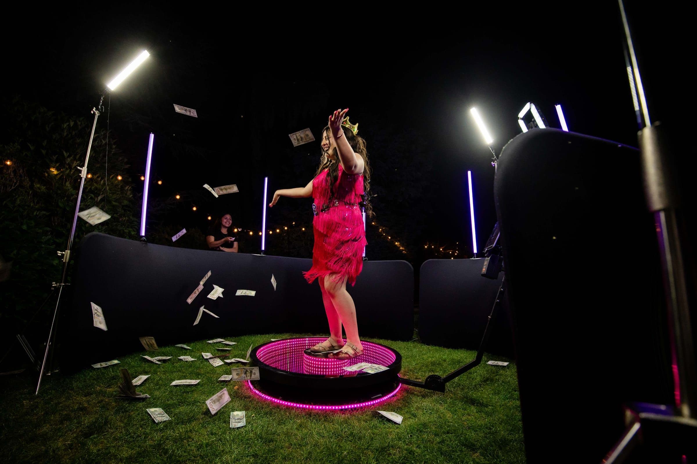 Event guests celebrating on the 360 booth platform