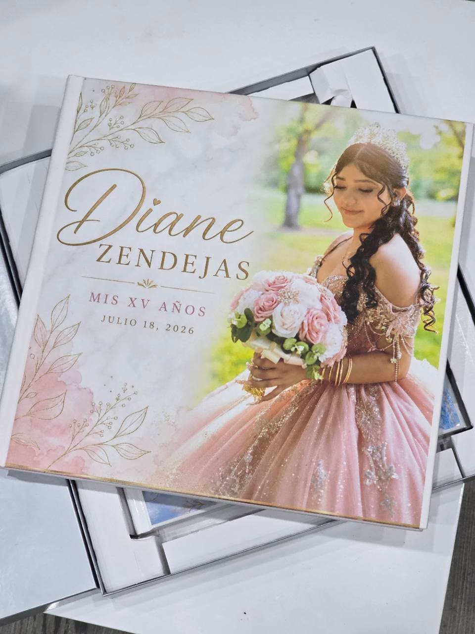 Finished personalized quinceañera photo album with a custom portrait cover
